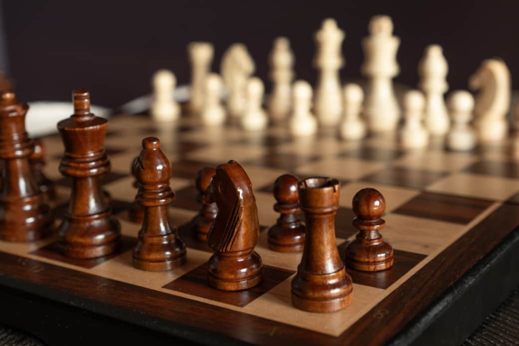 Queen of Hearts lounge: Dramatic red decor, cosy seating for games (chess), plus TV with Netflix