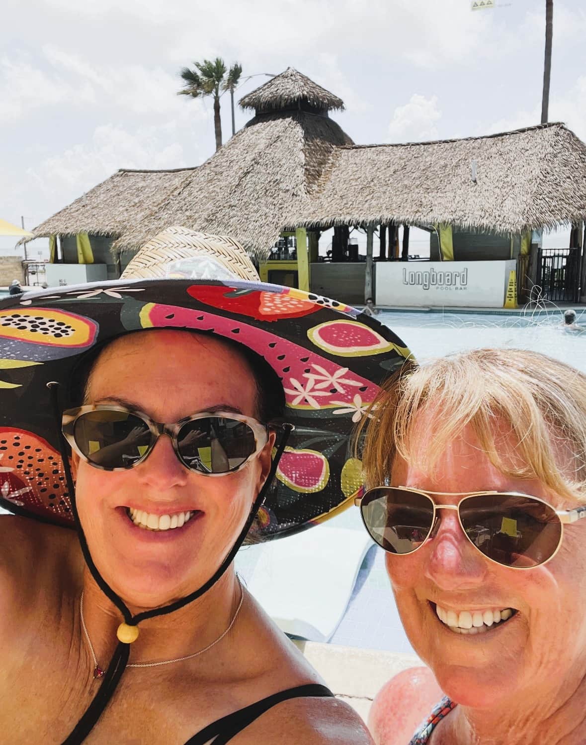 Relaxing by the pool at DoubleTree Galveston with drinks