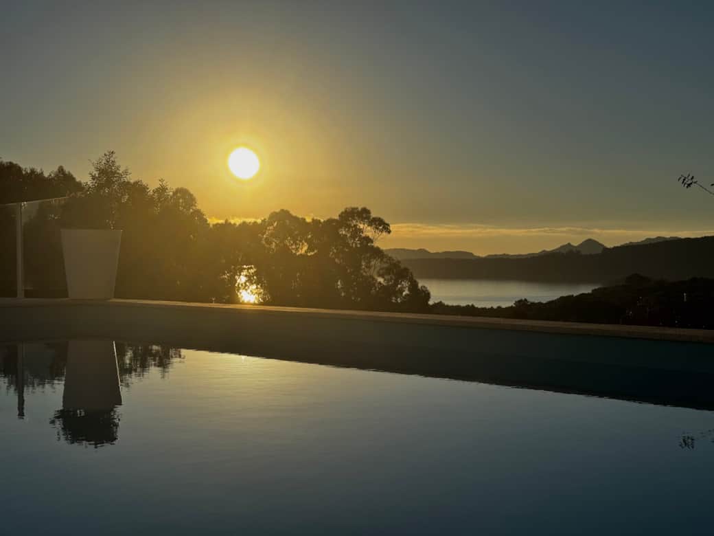 Sunset by the pool, open sea views and the sound of the ocean in the background.