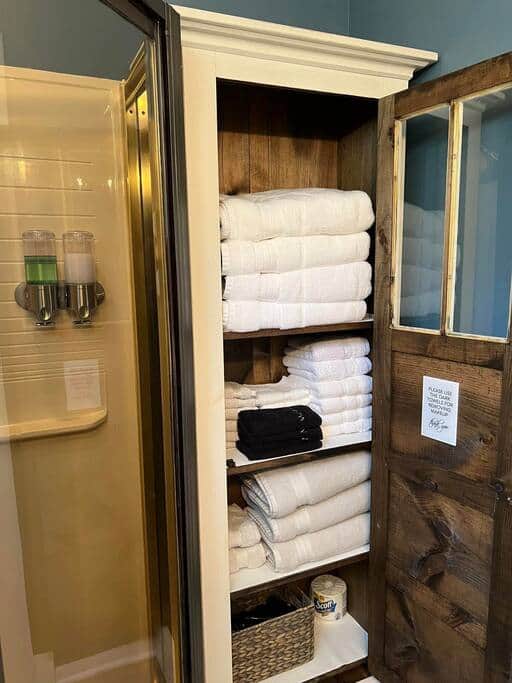 Towel cabinet in main bathroom