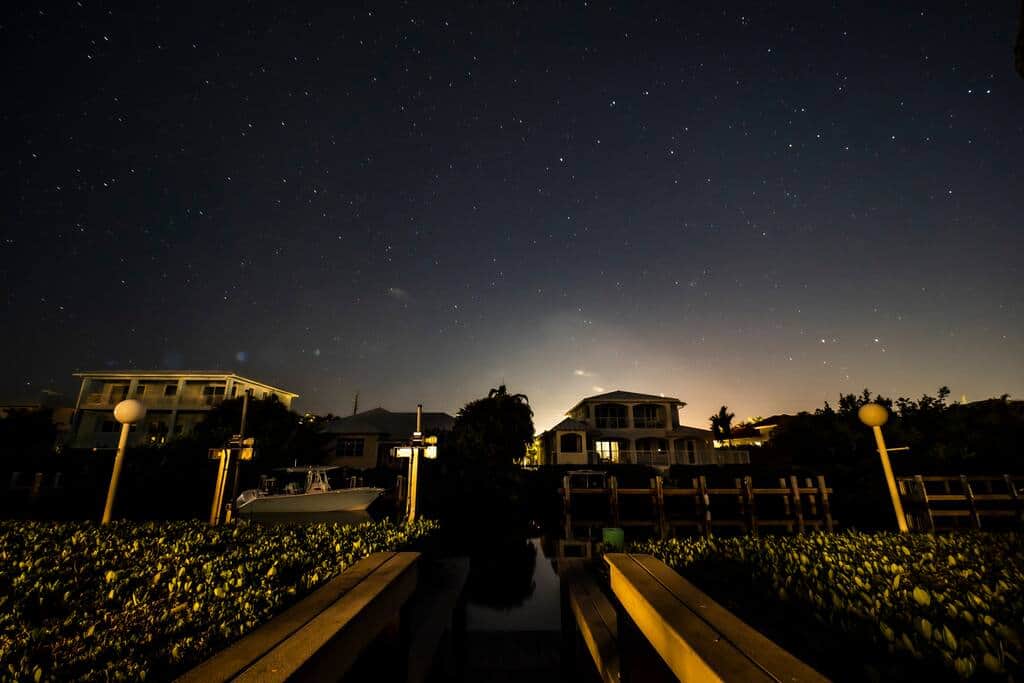 The night sky over the backyard, far enough from the lights that the stars genuinely show up.
