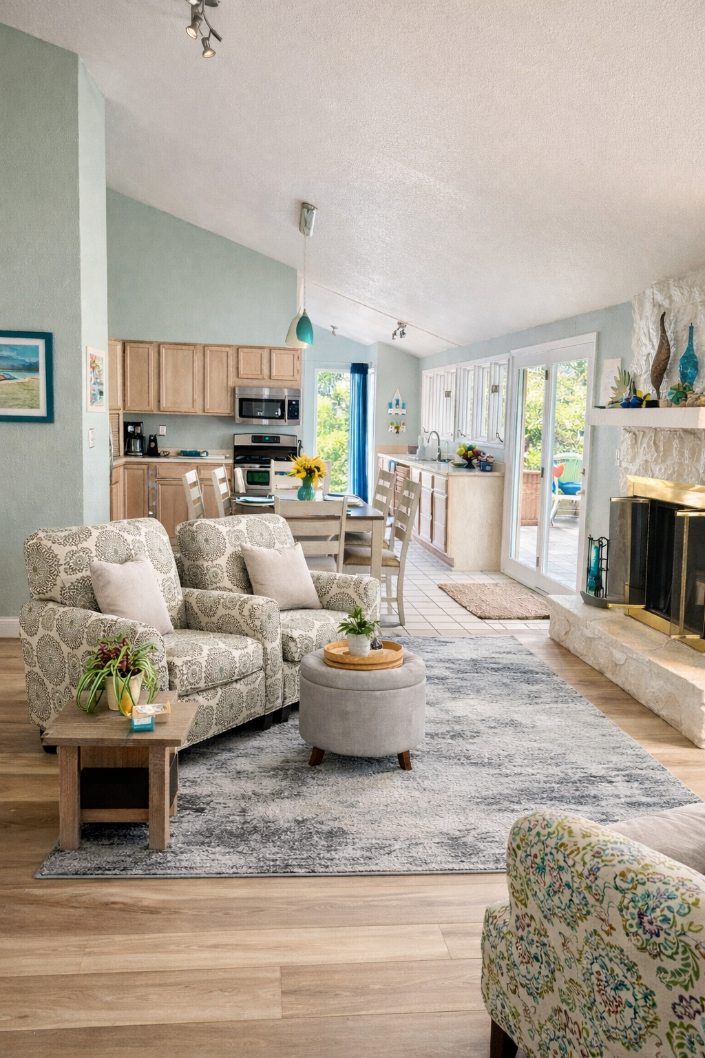 kitchen and sitting area with a sunroom and fireplace