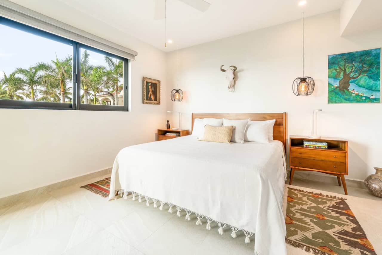 The master suite includes an en-suite bathroom and access to the private balcony 