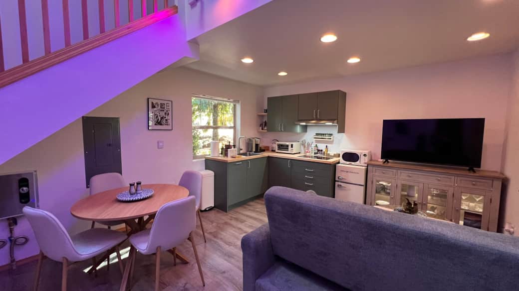 Enjoy meals at the cozy dining table for four, or cook in the fully equipped kitchenette.