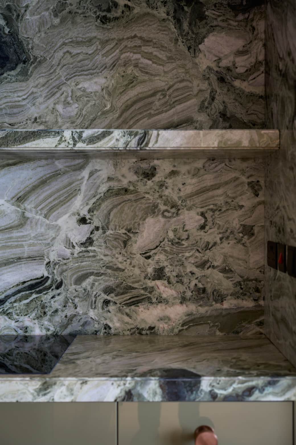 Modern bathroom with marble finishes and clean design.