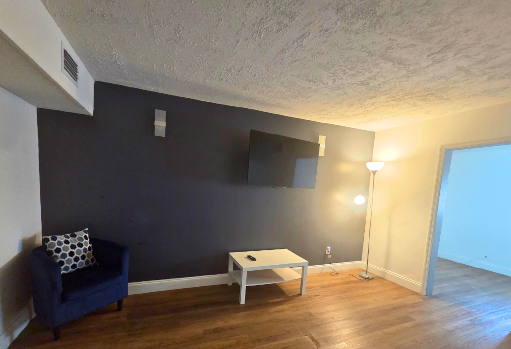 Comfortable living room with elegant decor and a comfy armchair to unwind. Lakeland, FL