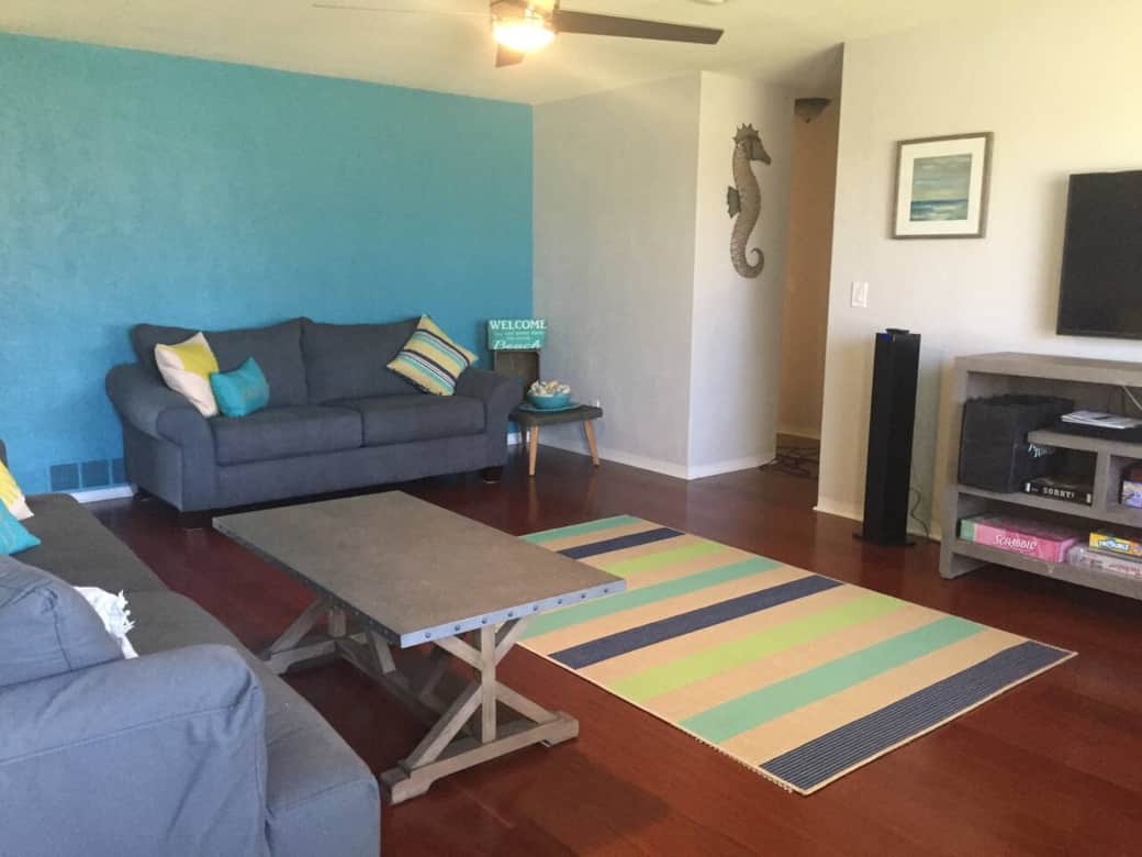 Large living room with 2 sofas and an oversized chair for ample seating.