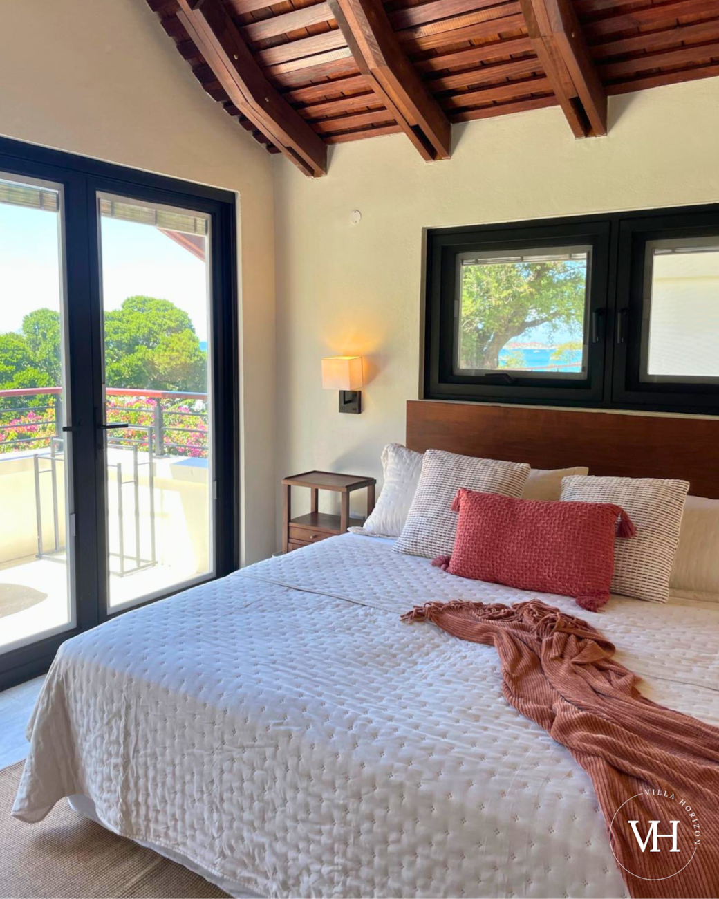 Bedroom with king bed that can convert to 2 twins upon request, smart TV, and private balcony.