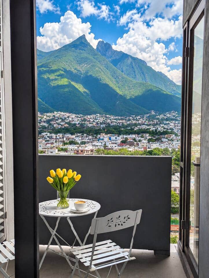 Private balcony with a charming bistro table, framed by dramatic clouds and inspiring mountain views. A peaceful spot to relax and enjoy Monterrey’s iconic scenery. Private balcony with a charming bistro table, framed by dramatic clouds and inspiring mountain views. A peaceful spot to relax and enjoy Monterrey’s iconic scenery.