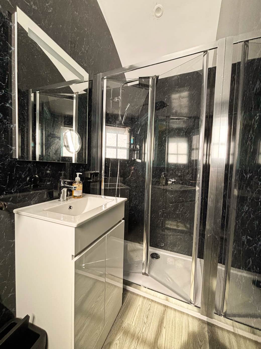 Modern ensuite with walk-in shower and sleek contemporary finishes.