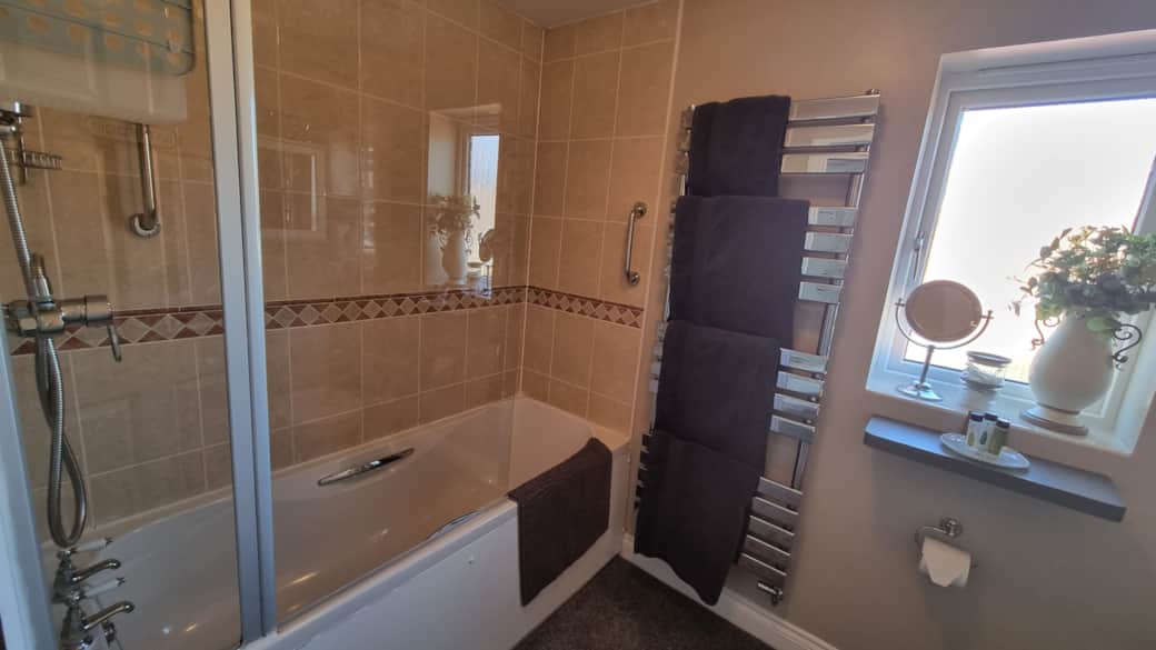 Guests Private Bathroom with over-bath shower
