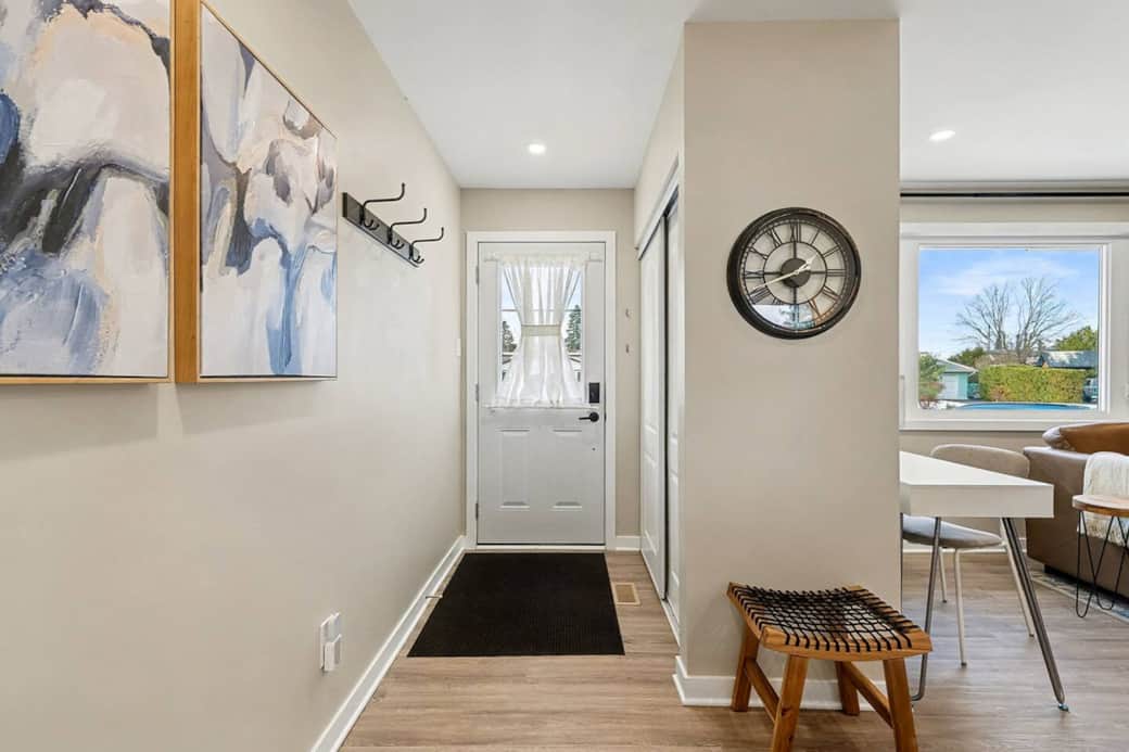 The entryway offers a large closet with hangers. A small stool is provided for those boots that are tough to get off.