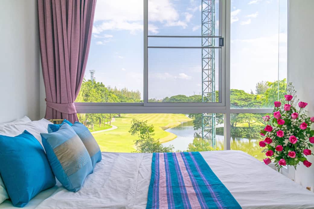 The Queen bed features Pha Sinh, a hand-woven fabric traditionally used as a woman's dress.