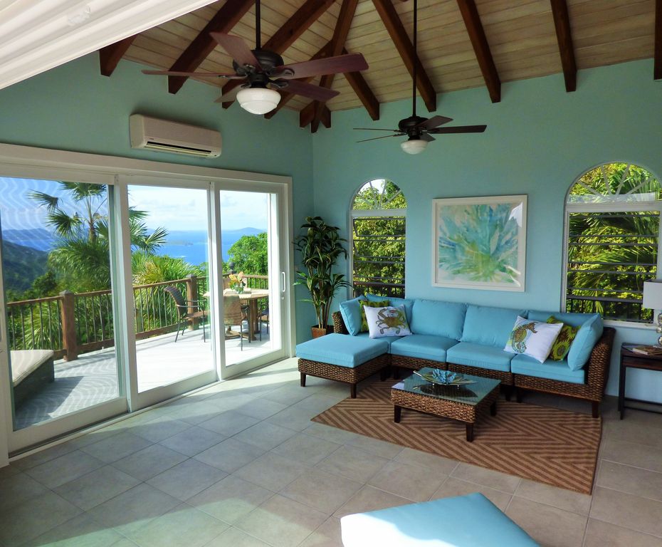 Living roon with 12' sliders leading to wrap around porch