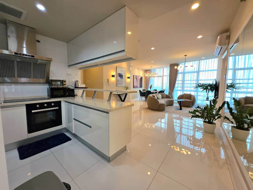 The kitchen features an open layout and is equipped with essential cooking items, cutleries, including an oven, coffee maker, and pots. The kitchen features an open layout and is equipped with essential cooking items, cutleries, including an oven, coffee maker, and pots.