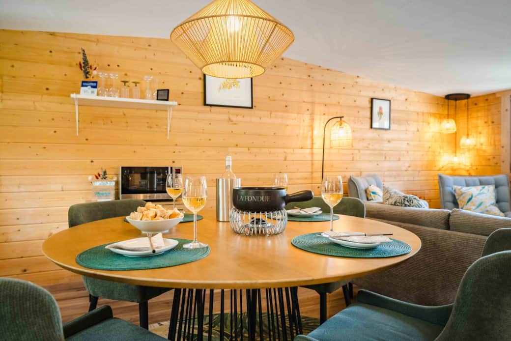 Dining table set for fondue in the open-plan Chalet Oz living area Dining table set for fondue in the open-plan Chalet Oz living area