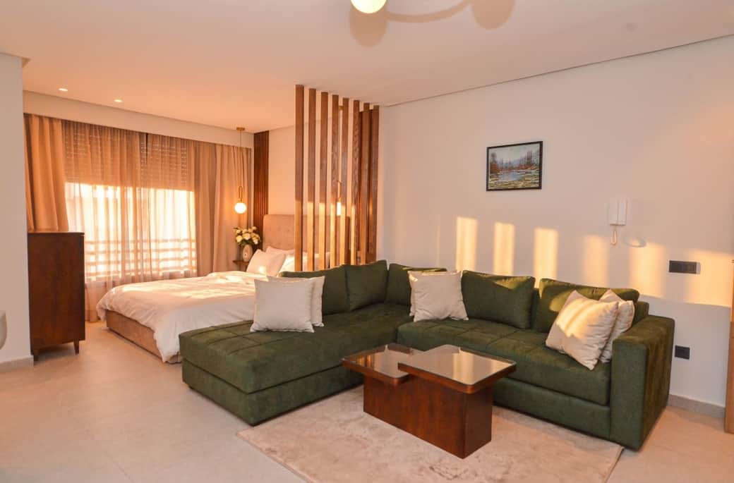 Cozy Studio with Green Sofa Cozy Studio with Green Sofa