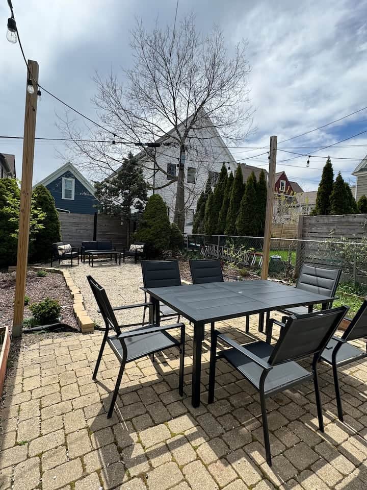 Private backyard patio with outdoor dining for six, perfect for al fresco meals 