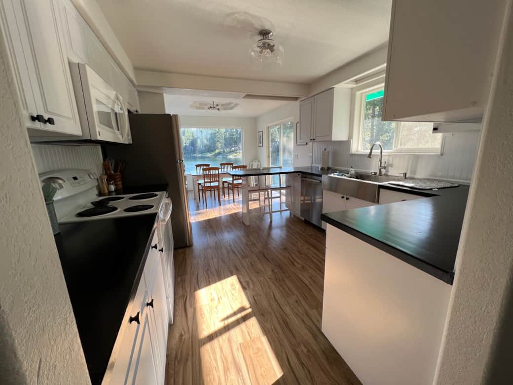 Full stocked kitchen and dining room with a view of the lake