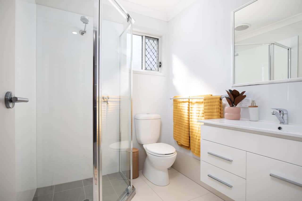 Bathroom: Stylish bathroom with walk-in shower, vanity, and clean finishes 