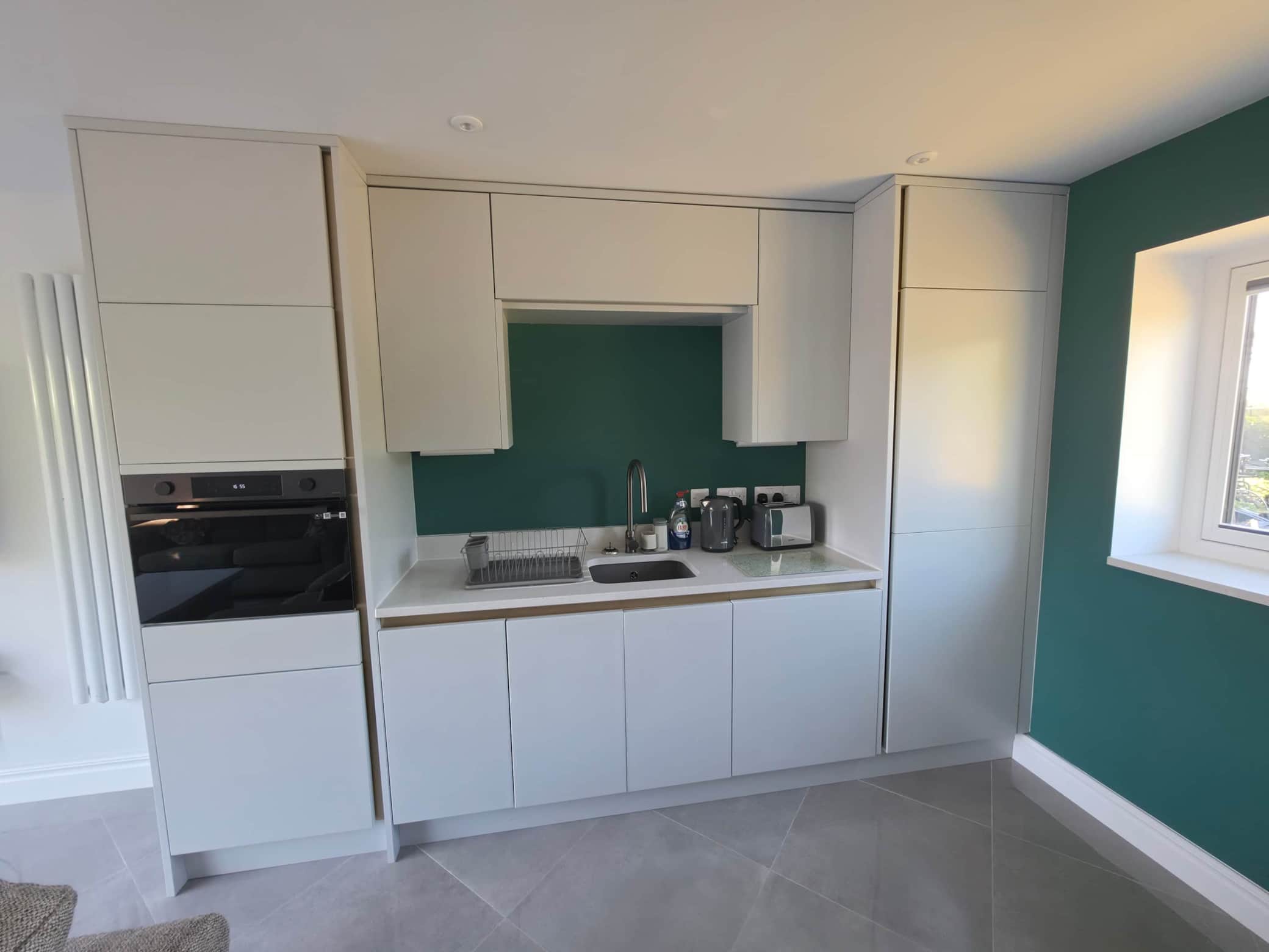 Kitchen with microwaveovengrill combo and portable hob