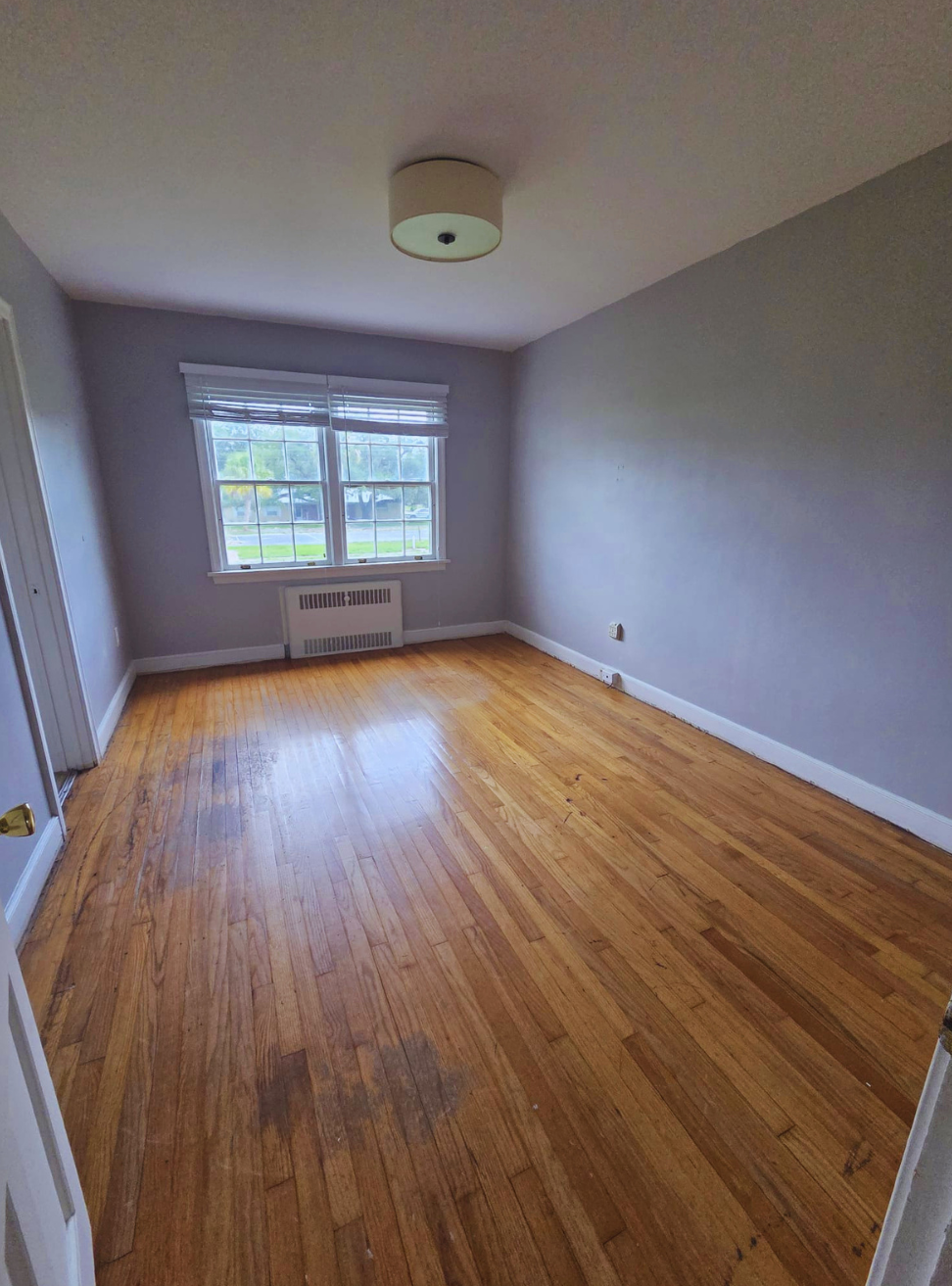 Large bedroom with bright windows and elegant ceiling light for added charm. Mulberry, FL Large bedroom with bright windows and elegant ceiling light for added charm. Mulberry, FL