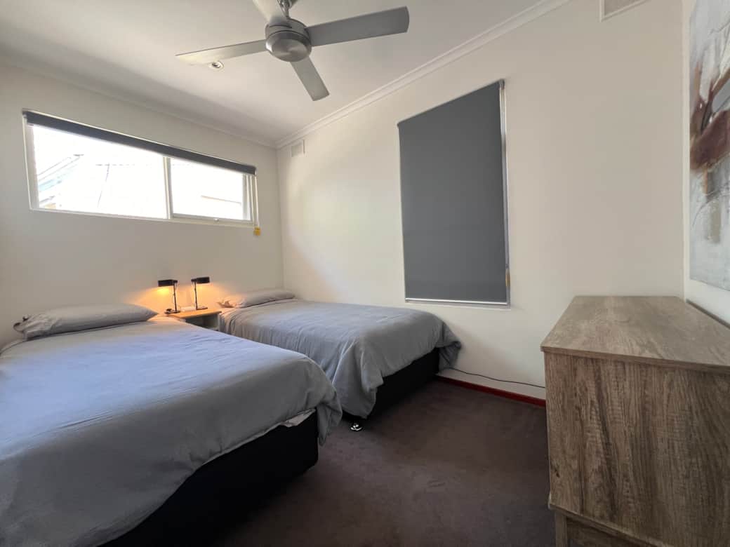 TrooBloo Glenelg North Unit | Second bedroom equipped with two long single beds TrooBloo Glenelg North Unit | Second bedroom equipped with two long single beds