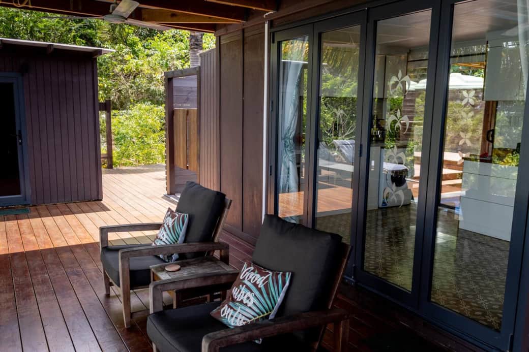 Comfortable seats on the front deck with bifold doors that open up the studio to your own indoor-outdoor living retreat.
