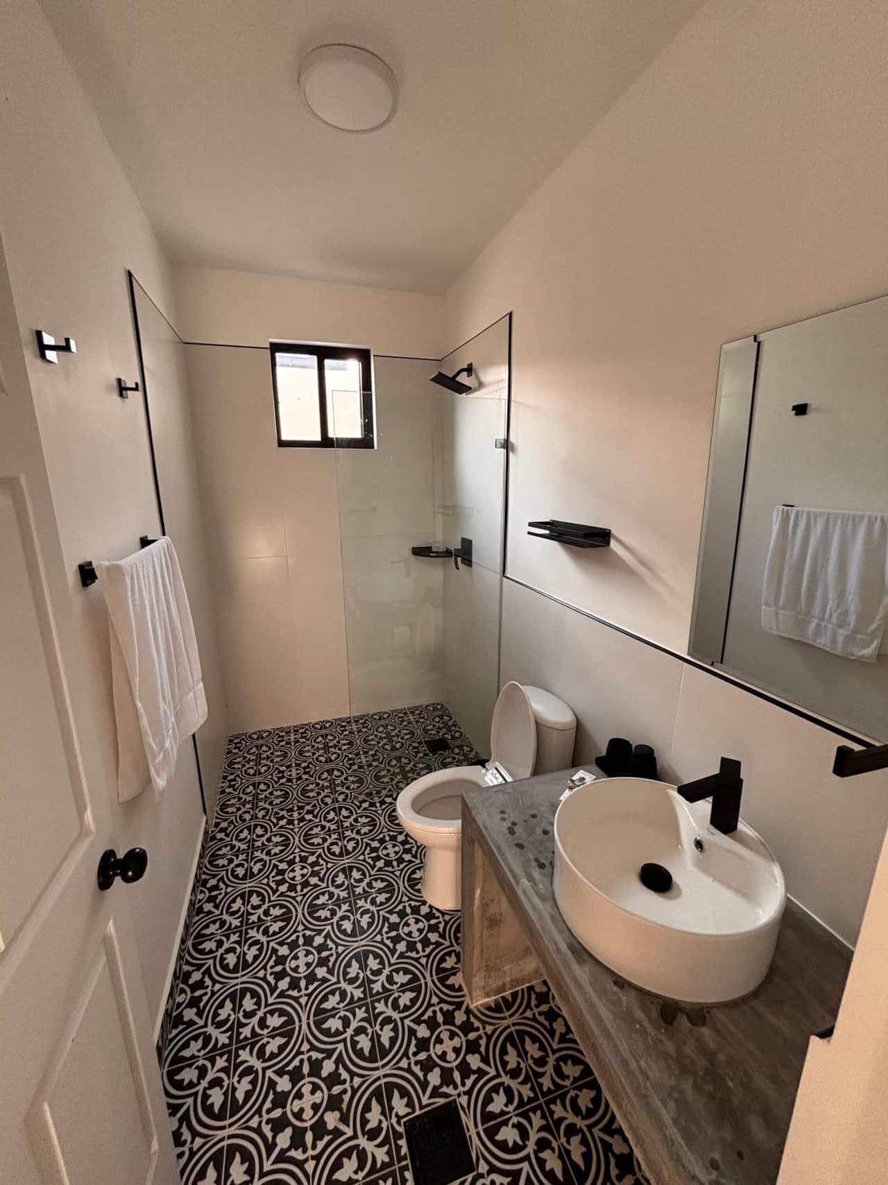 Stunning geometric tiles highlight the modern bath of this eco-friendly Panama vacation rental.