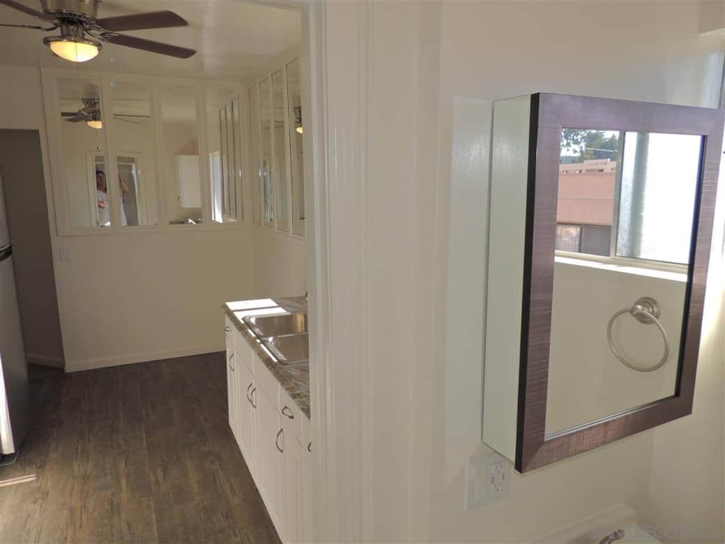 Looking out bathroom to kitchen. Looking out bathroom to kitchen.