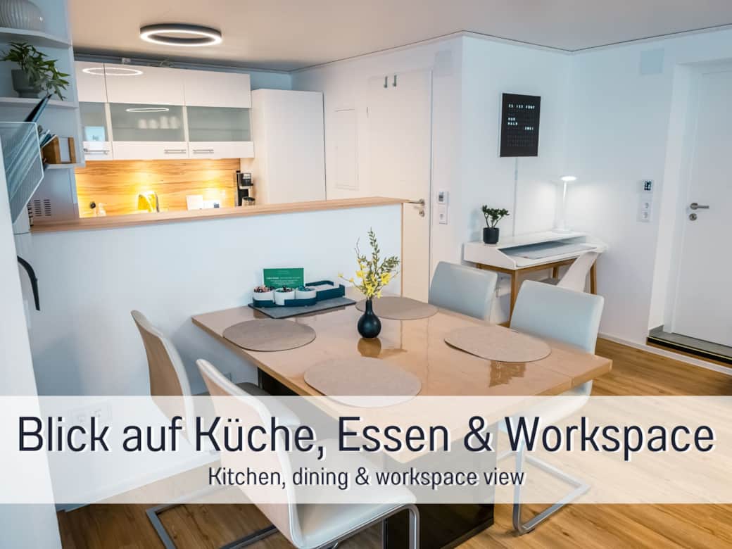 Wohnbereich mit Blick auf Küche, Essplatz und Arbeitsplatz