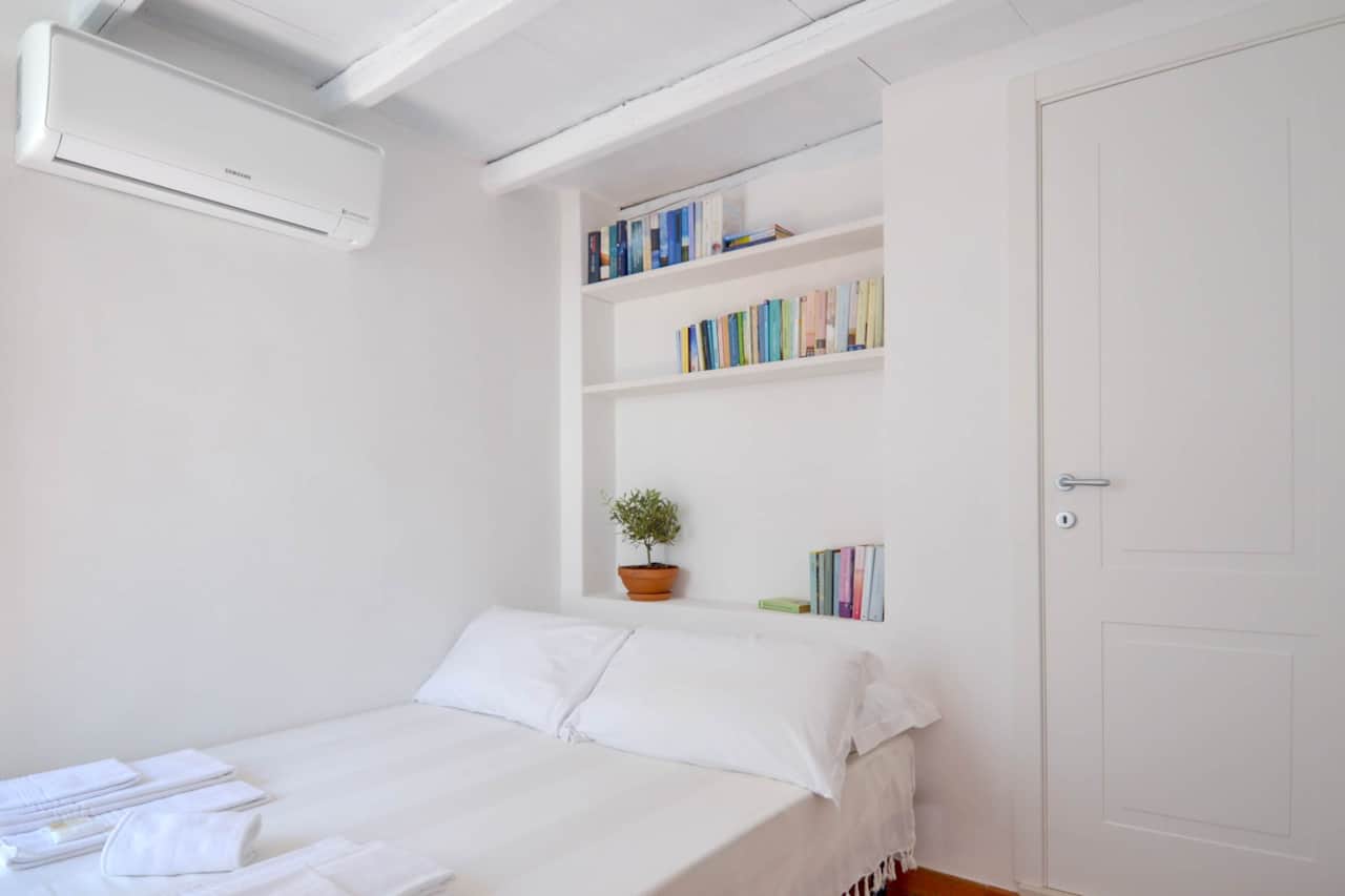 Elena - bedroom - books - A/C