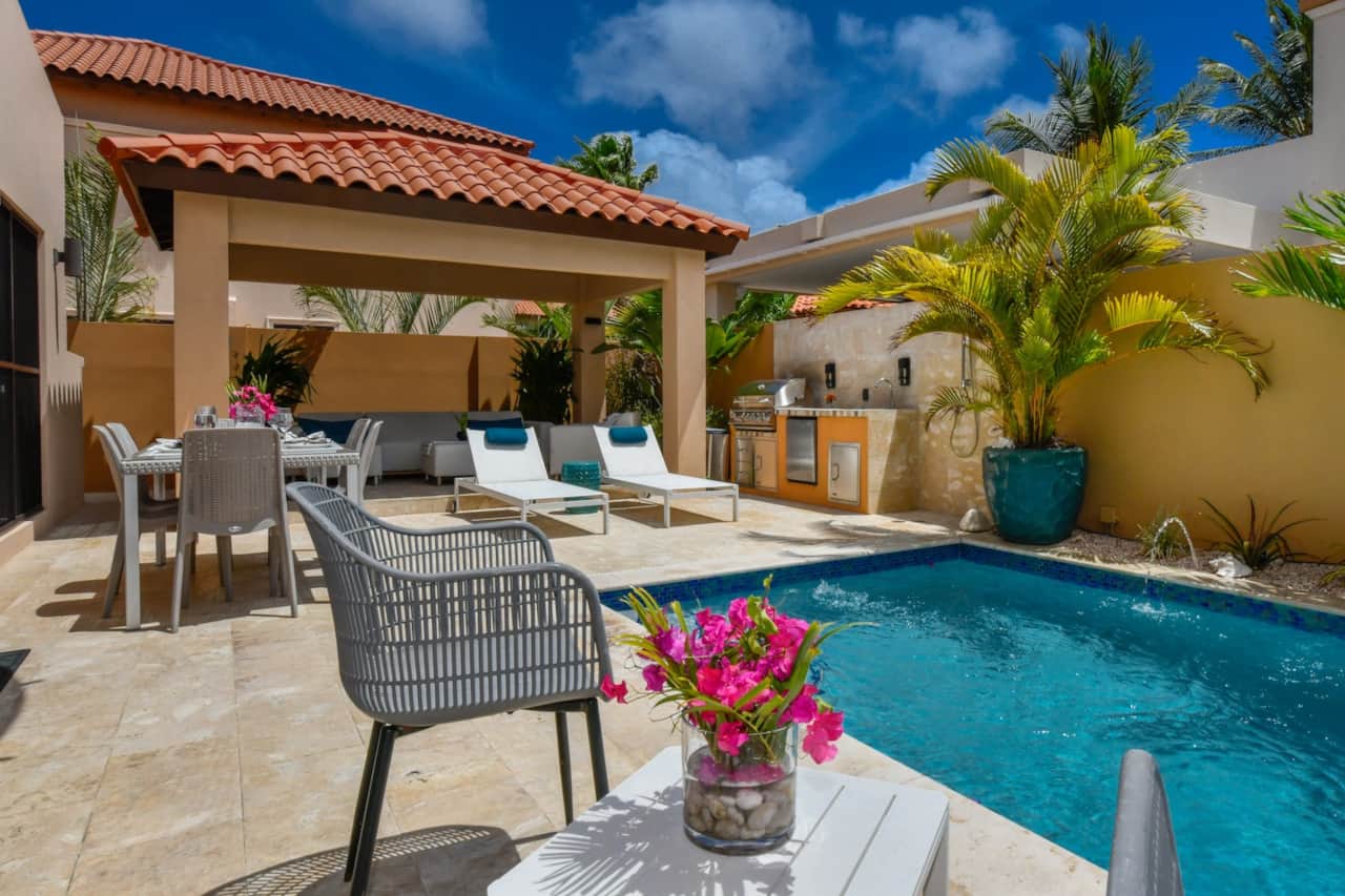 Backyard with private pool, lounging, BBQ, and dining seating for 6