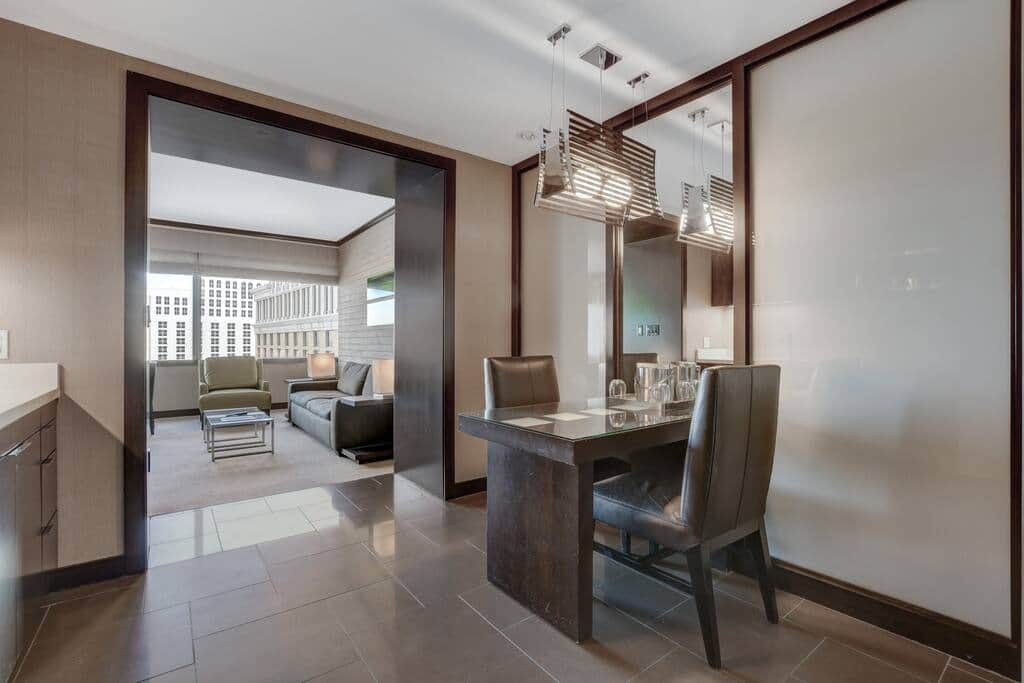 Dining Nook with Pendant Lighting and Mirror Wall Dining Nook with Pendant Lighting and Mirror Wall