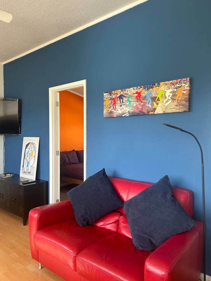 Our comfy red leather 2 seater, with adjustable lamp