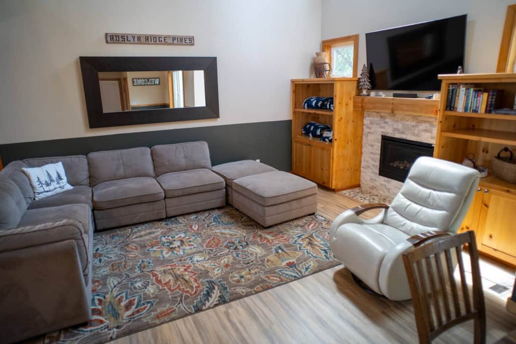 Sectional couch with ottoman and electric recliner.  Remote controlled gas fireplace with Samsung 65" TV with Roku and soundbar