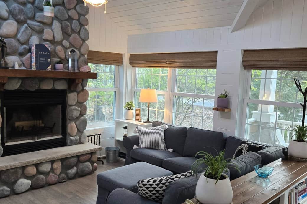 The fireplace is wood-burning but also features a natural gas ignitor to help get the fire started. Any available firewood is yours to use. Operation instructions are under the lamp to the right of the fireplace. Enjoy!