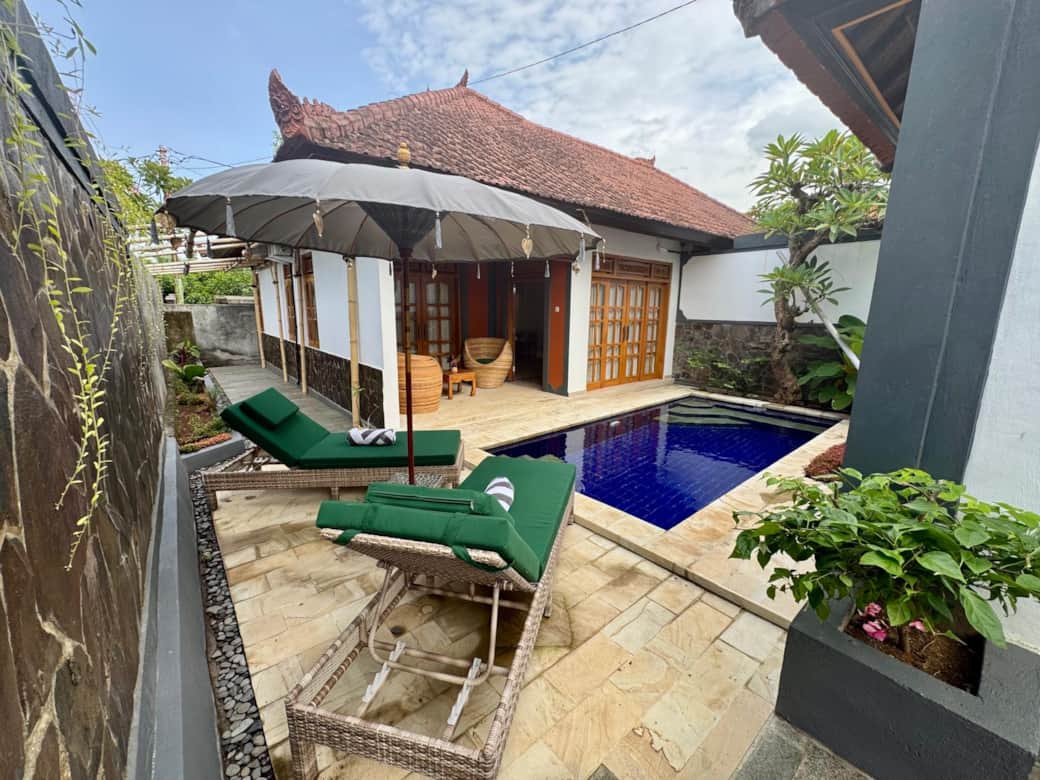 Rear private garden featuring pool, outdoor seating area leading into the open plan living spaces. 