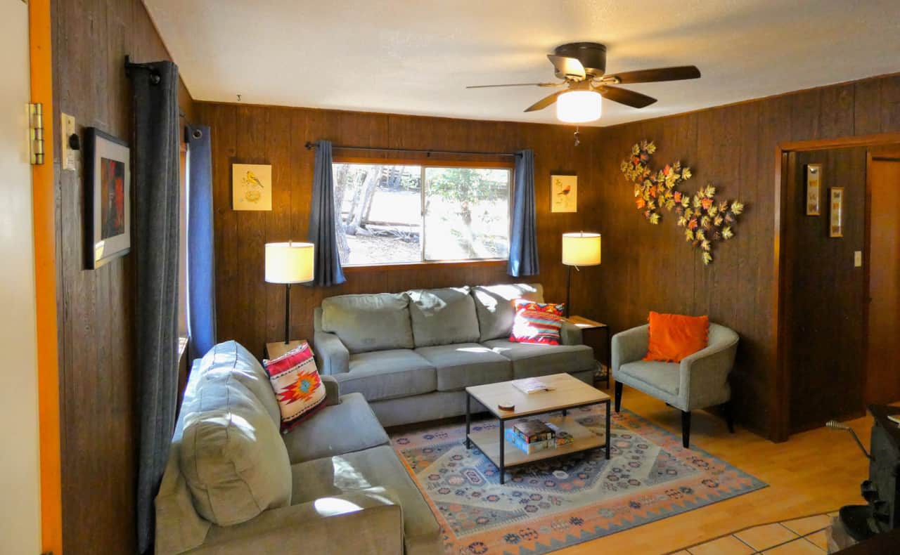 Living Room with comfortable couches and reclining chair.