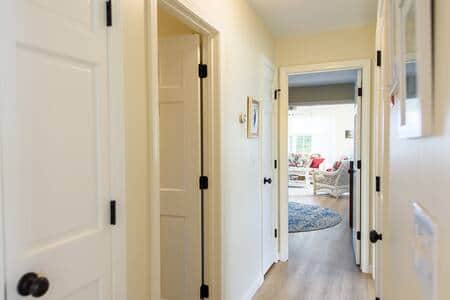 The 1st floor hallway looking into the bedroom and sunroom.