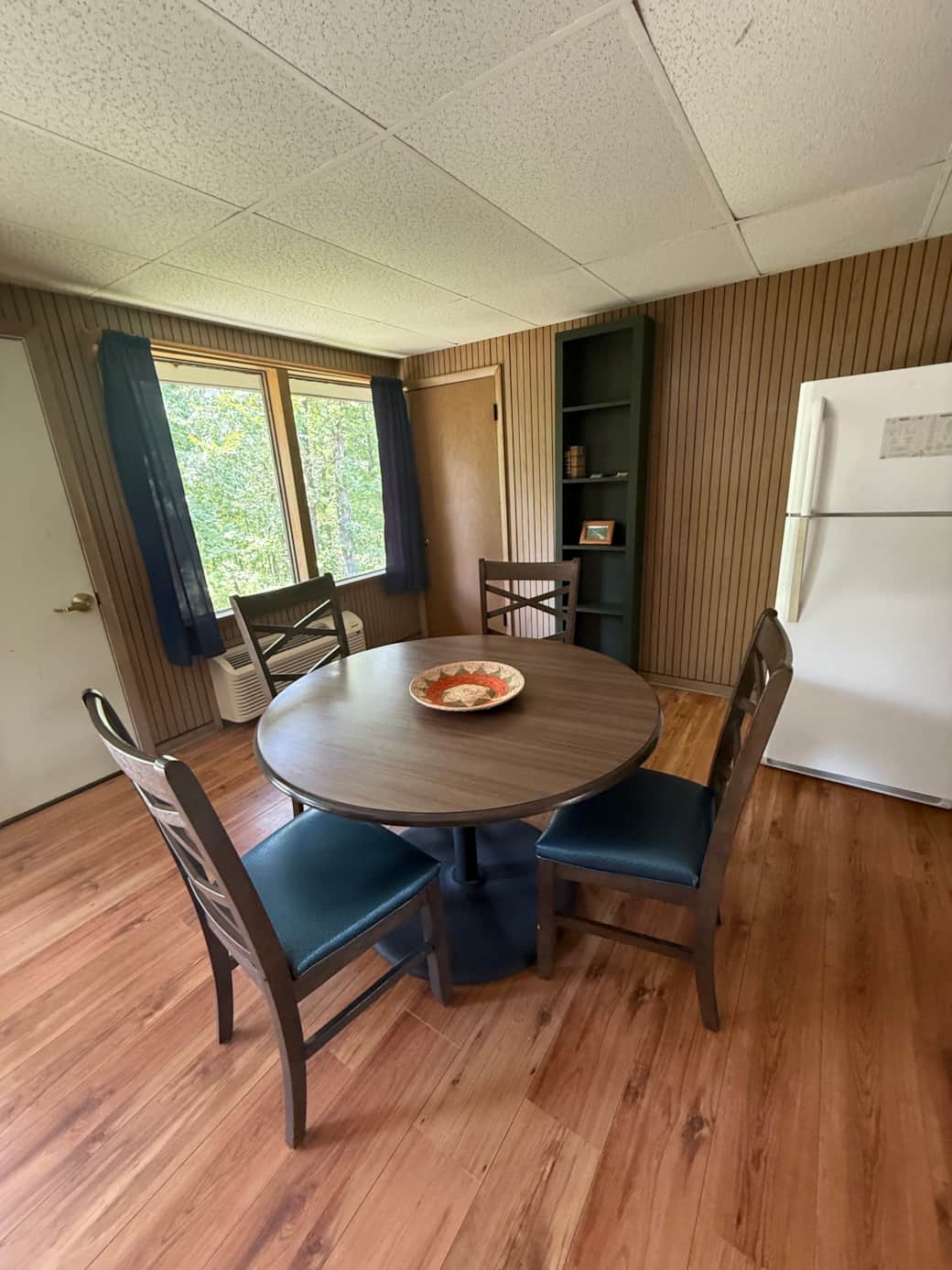 Cabin dining area with window view at Buffalo Point near Buffalo National River