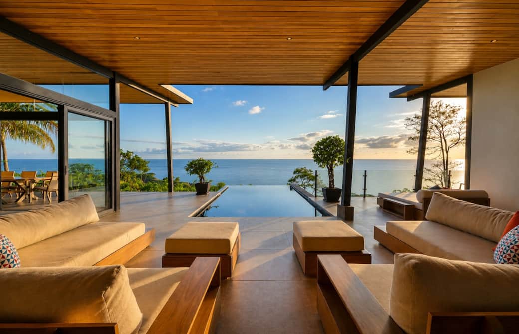 The heart of the villa—an expansive open-air living space where the infinity pool meets the Pacific horizon. Relax in total comfort while enjoying breathtaking ocean views, tropical breezes, and unforgettable sunsets.