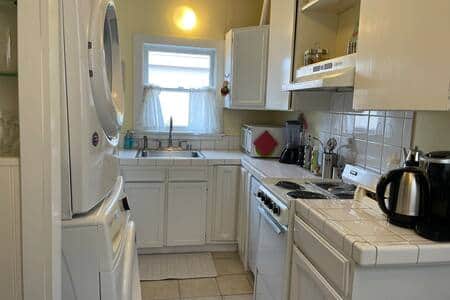 Fully equipped kitchen with dishwasher microwave, and coffee bar