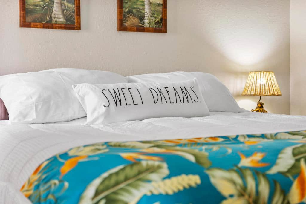 Comfortable king sized bed for restful peaceful sleep with extra pillows.