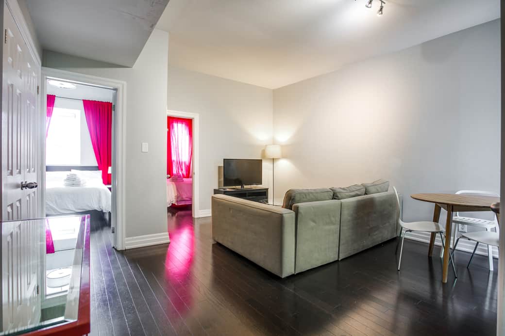 Welcoming living room in a Toronto short-term rental, bathed in natural light.
