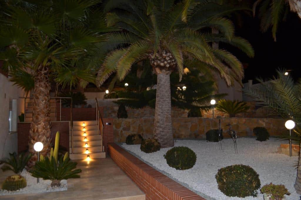 Elegant staircase leading to the upper level (NightView)