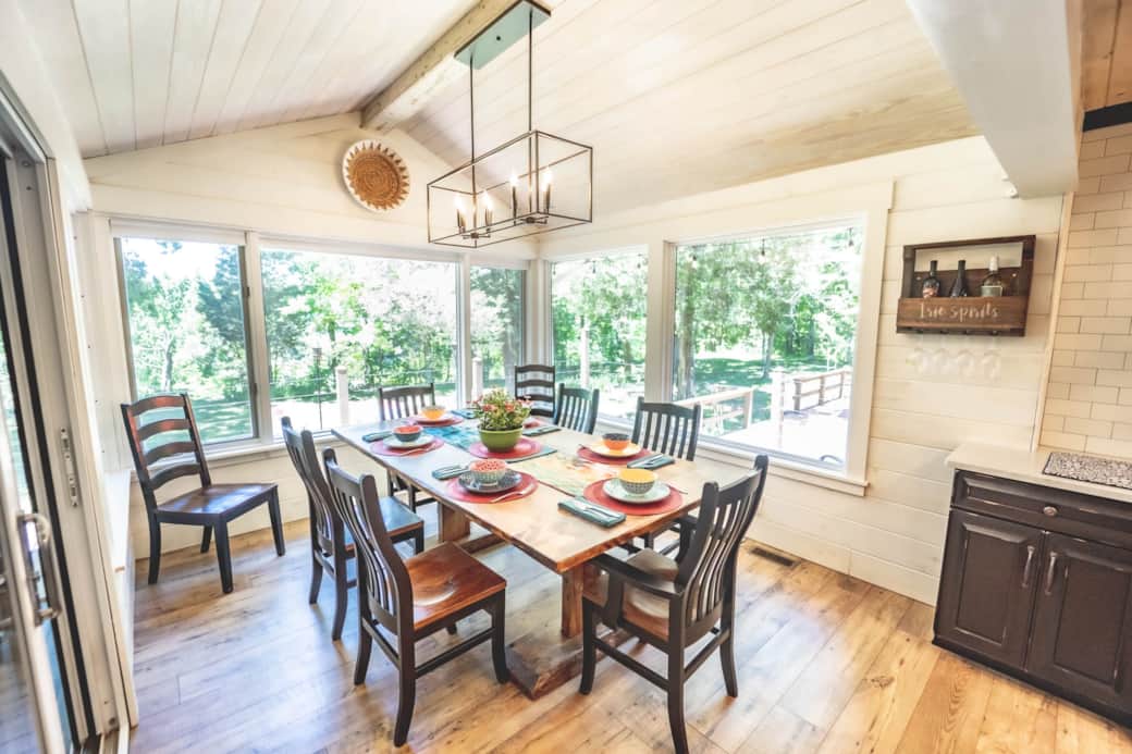 The dining room overlooks the lake and the dining area on the deck The dining room overlooks the lake and the dining area on the deck