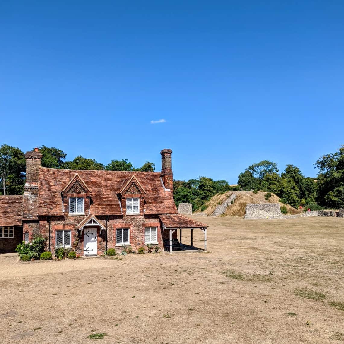 The historic Berkhamsted Motte and Bailey Castle ruins near the towpath, a premier cultural destination to explore on narrowboat holidays.
