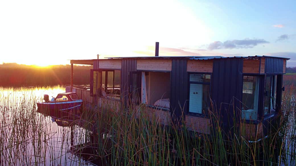 Full Side View Of Small Boat, Patio, Living Room, Bedroom and lastly Bathroom.