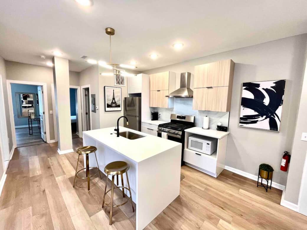 Full kitchen , breakfast waterfall quarts bar, range with hood,microwave, dishwasher, refrigerator, garbage disposal.